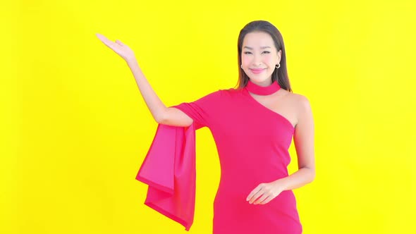 Young asian woman with action on color background