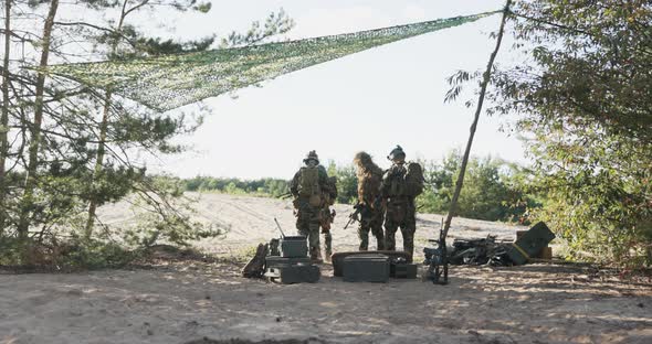 Soldiers Go Out Into Field From Military Base Where They Leave Crates of Equipment in Search of the