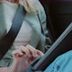 Close Up Young Woman Using a Digital Tablet Sitting in Backseat Car - VideoHive Item for Sale