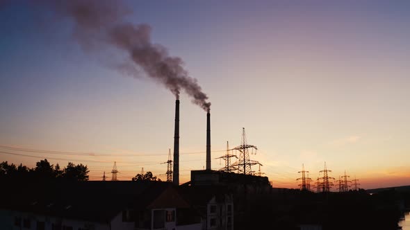 Power plant with pipes and smoke. Environmental pollution problem and nature environment