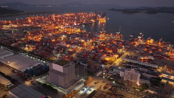 Aerial footage of Yantian container terminal at night in Shenzhen city, China, Hyperlapse alt