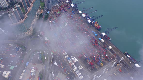 Aerial top view of container in logistics or shipping business at Victoria Harbour, Hong Kong.