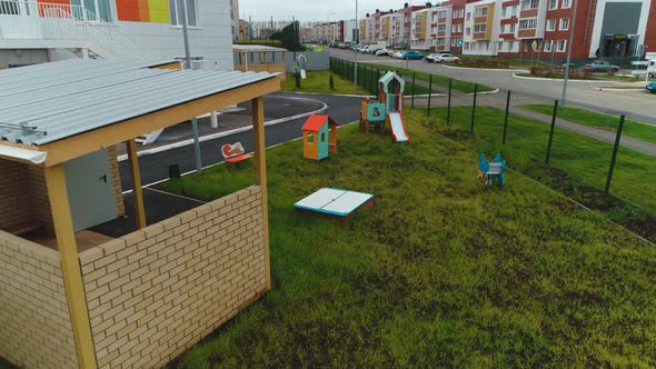 Playground with Arbor and Attractions Near Kindergarten