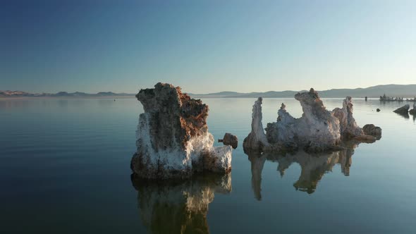 Outdoor Adventure Travel Background. Scenic Pike-shape Formations in Blue Water