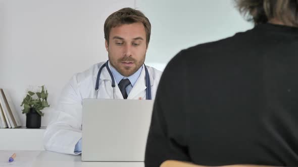 Doctor Talking with Patient in Clinic