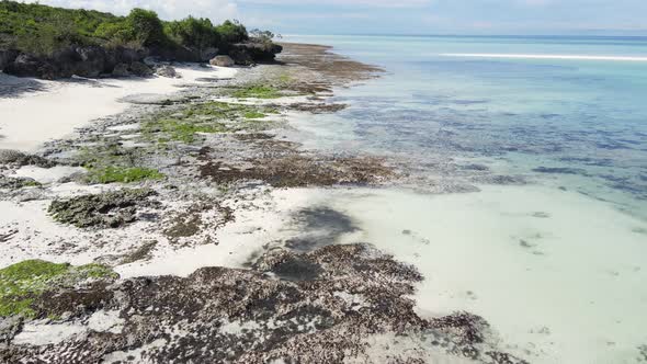 Aerial View of Low Tide in the Ocean Near the Coast of Zanzibar Tanzania Slow Motion