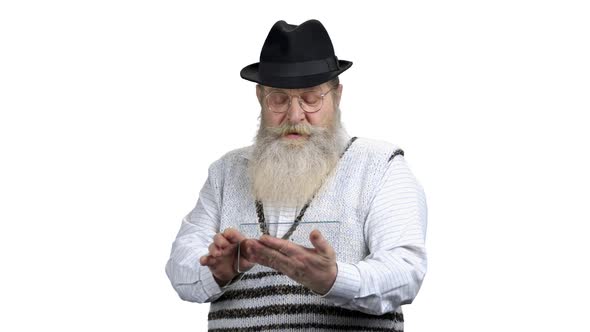 Senior Bearded Man Using Futuristic Tablet Pc