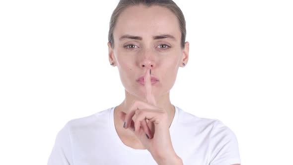 Middle Aged Woman Gesturing Silence Finger on Lips
