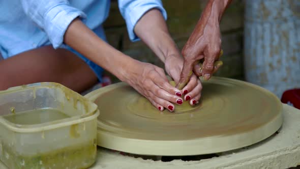 Close View Woman Studies Make Clay Pot in Pottery Shop