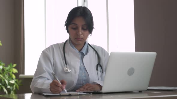 Indian Telemedicine Doctor Wear Headset Consulting Patient By Online Video Call