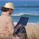 Freelancer Woman Working in Her Notebook on Beautiful Coastline - VideoHive Item for Sale