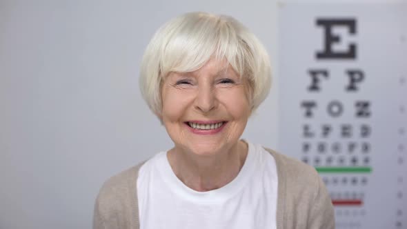 Senior Woman Smiling After Successful Cataract Removal Surgery Focused Vision