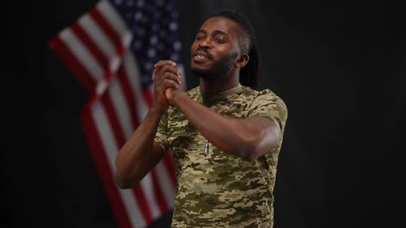 Portrait of Male African American Military Spokesperson Greeting Public in Camera Flashes Thanking