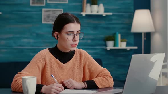 University Student Attending Online Class on Videoconference alt