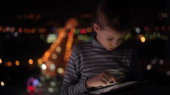 Boy Playing on a Tablet