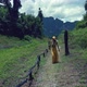 Cute Smiling Asian Girl Walking on a Trail in Cheow Lan Lake Thailand - VideoHive Item for Sale