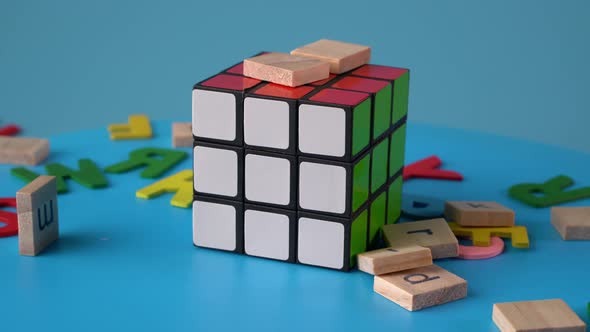 Alphabet block drop at rubik's cube