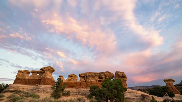 Sunset time lapse over desert rock formation in Devils Garden