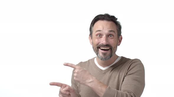 Happy and Cheerful Excited Mature Father with Beard Grey Hair Pointing Fingers Left at Corporate