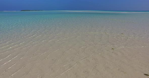 Tropical birds eye copy space shot of a paradise sunny white sand beach and blue ocean background in