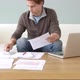 Worried young man doing paperwork - VideoHive Item for Sale