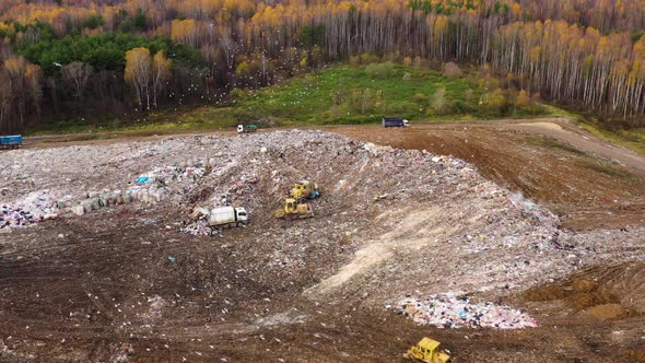 Large Dump with Working Garbage Trucks, Top View.