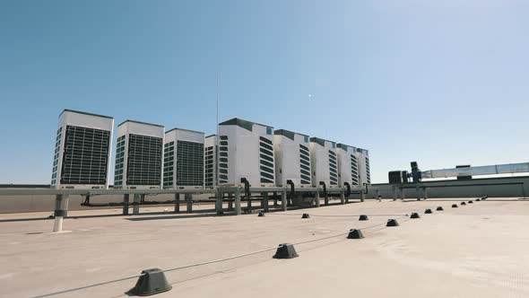 An Air Conditioning System of Two Rows of Air Conditioners is Located on the Roof of the Business