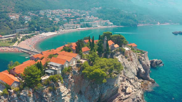 Over of Sveti Stefan Small Islet and Resort in Montenegro with Architectures and Trees