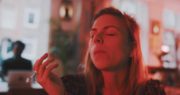 Woman enjoying cake close up