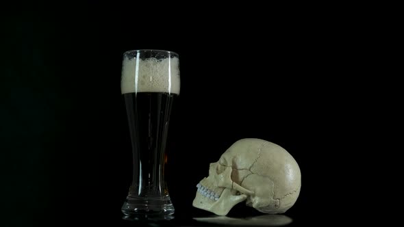 Skull with a glass of beer.