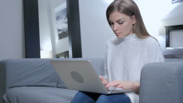 Casual Woman Working with Laptop in His Lap