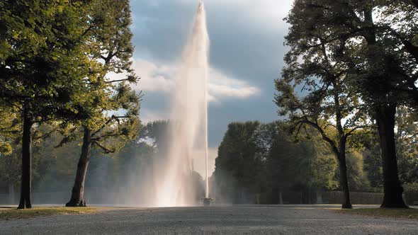 A Huge, High Jet of Water Fountain Pouring Out of a Bowl Placed on the Ground