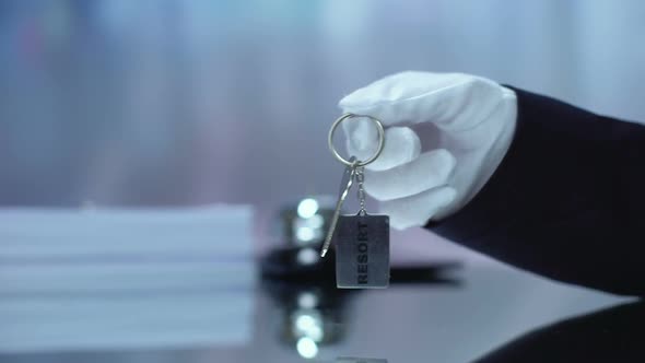 Administrator Giving Keychain to Guest, Visiting Resort, Running Hotel Business