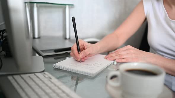 Close Up Hands of Unrecognizable Woman Student Sitting in Front of Computer with Coffee Learns