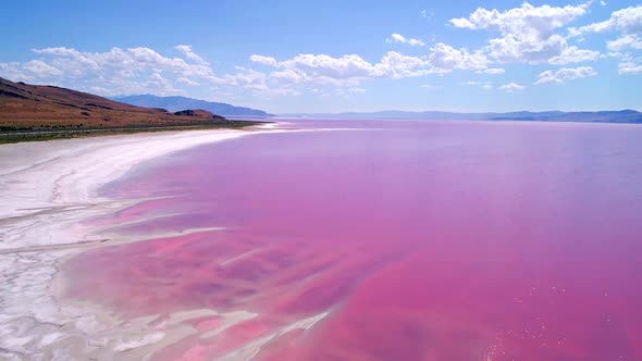 Flying backwards over the Great Salt Lake in pink phase