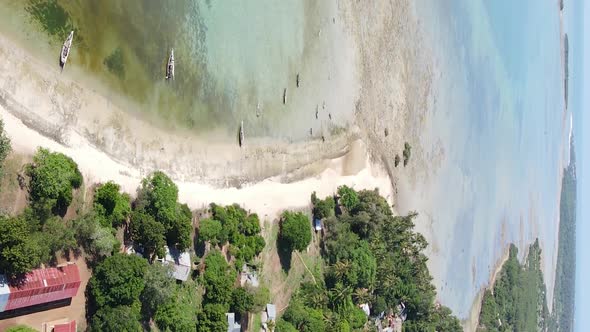 Vertical Video of Low Tide in the Ocean Near the Coast of Zanzibar Tanzania Aerial View