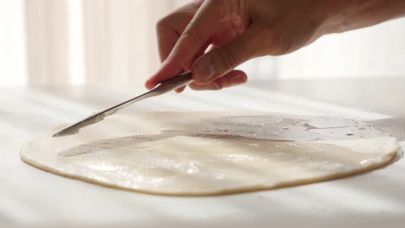 Puff pastry  making with fat spreading over dough with knife   4K 2160p UltraHD footage - Laminated 