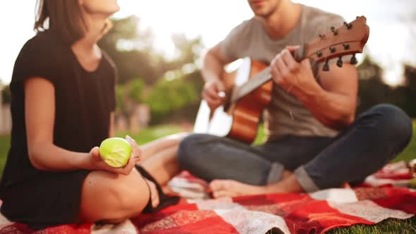 Young Beautiful Couple Smiling Resting in Park