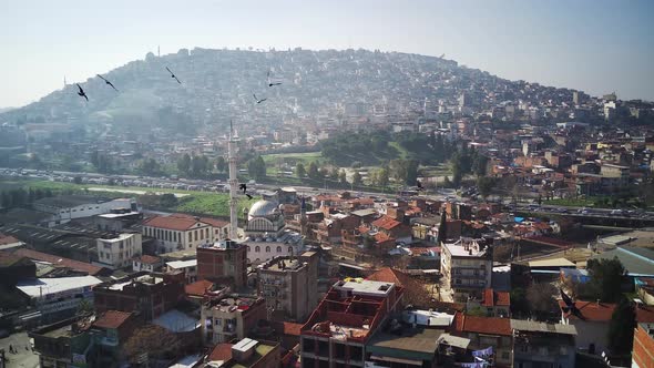 Drone view on poverty slum district and muslim mosque