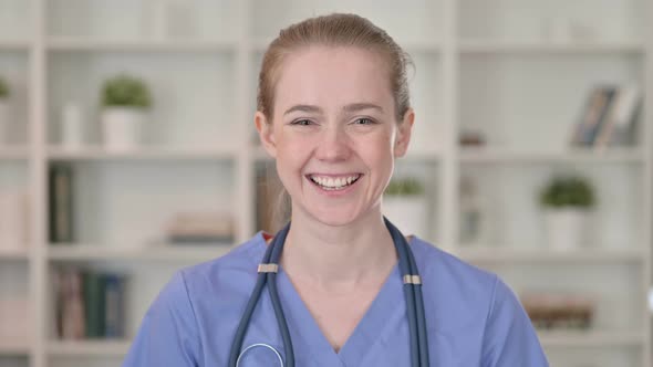 Smiling Young Female Doctor Looking at the Camera 