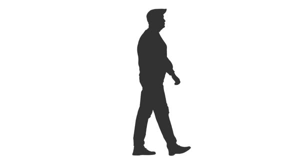 Silhouette of Adult Man Walking in Cap alt