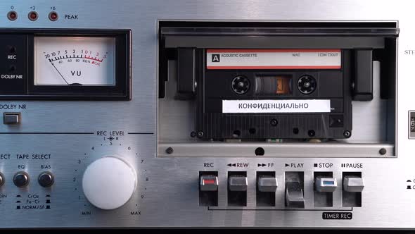 Audio Cassette Tape With Confidential Russian Recording in Vintage Deck Player