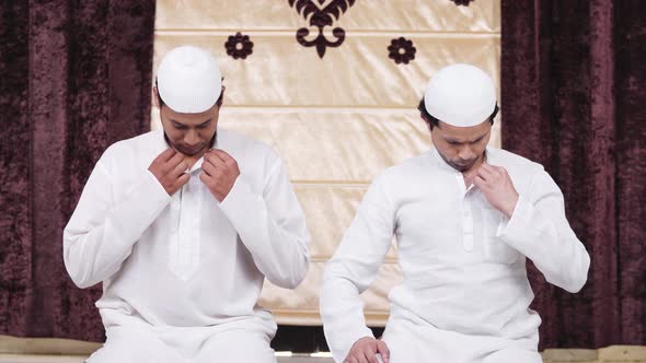 Muslim men performing rituals of Ramadan prayer