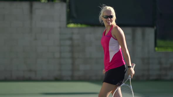 Women playing tennis.