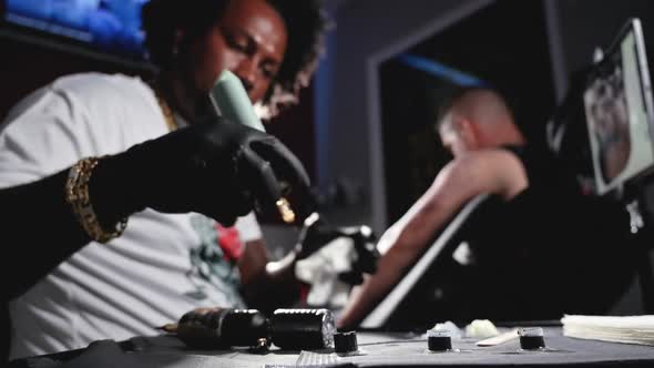 Cinematic Slow Motion Tattoo Artist Machine Filling Ink