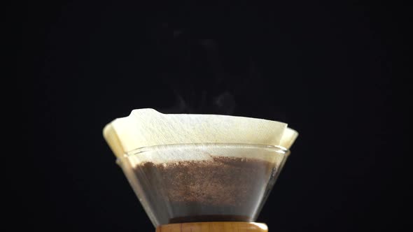 Woman making coffee at home