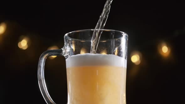 Pouring Draft Beer Into a Glass at a Bar or Pub