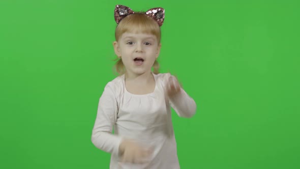 Girl in Headband with a Cat Ears Dancing