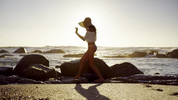 Woman walking on the beach 4k