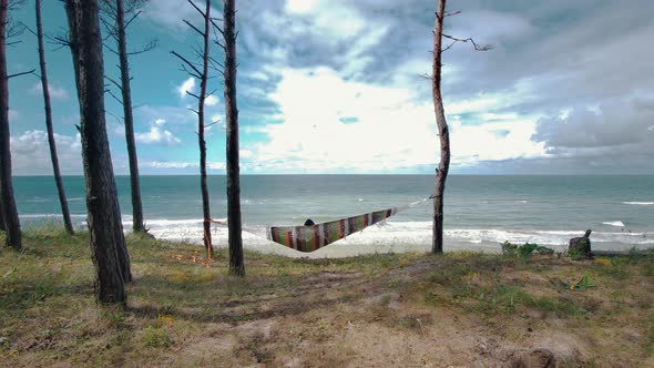 Relaxing in the Hammock by the Windy Baltic Sea and Enjoying Sea View 